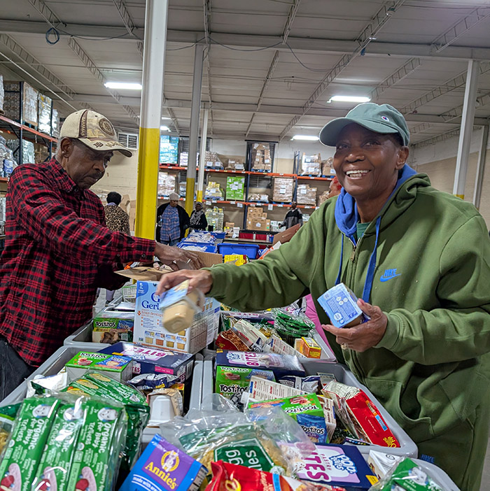 Urban Recipe Food Co-op members put together a food distribution